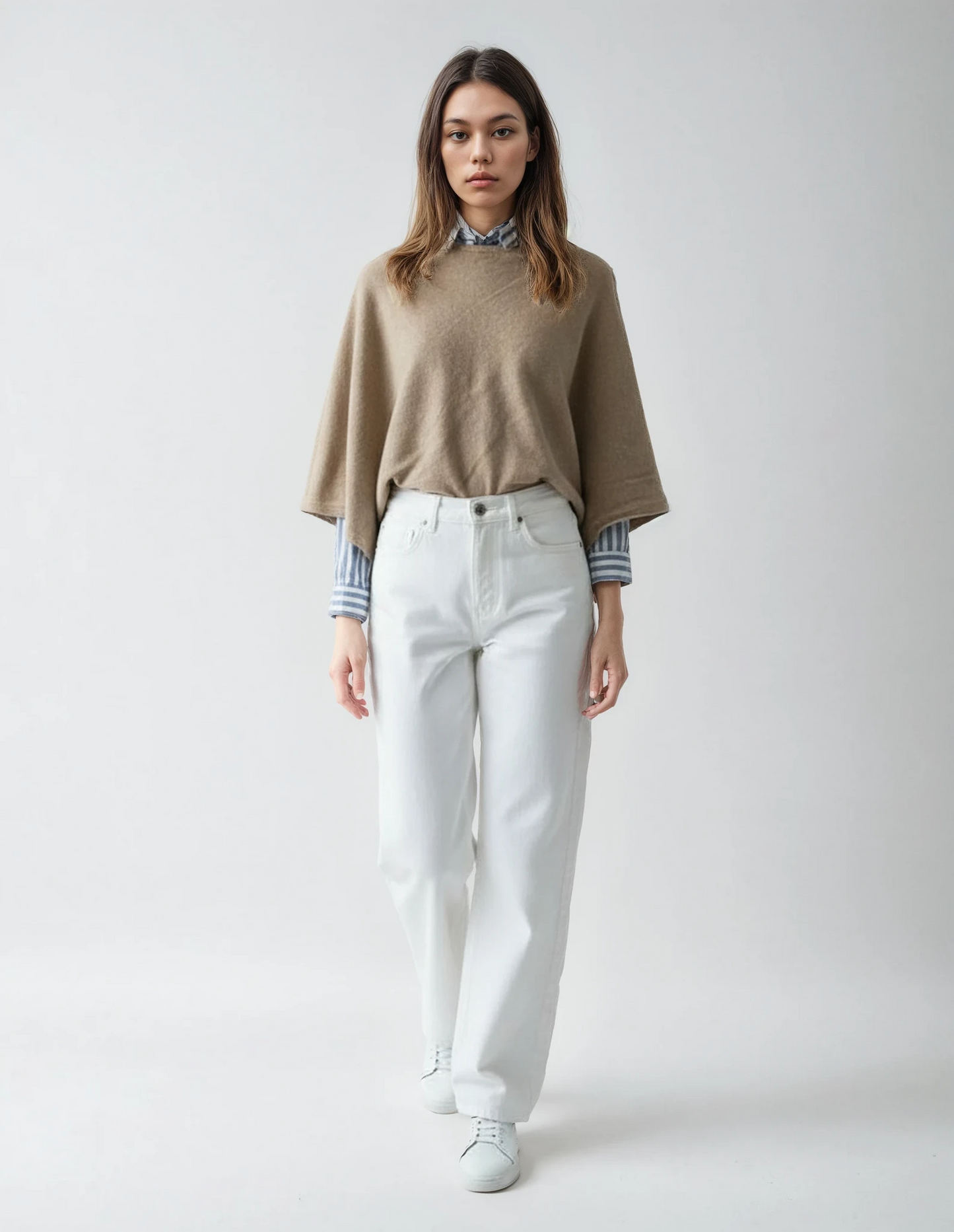 Women's bege wool poncho (one size). Versatile and flattering loose fit for easy layering in fall and winter