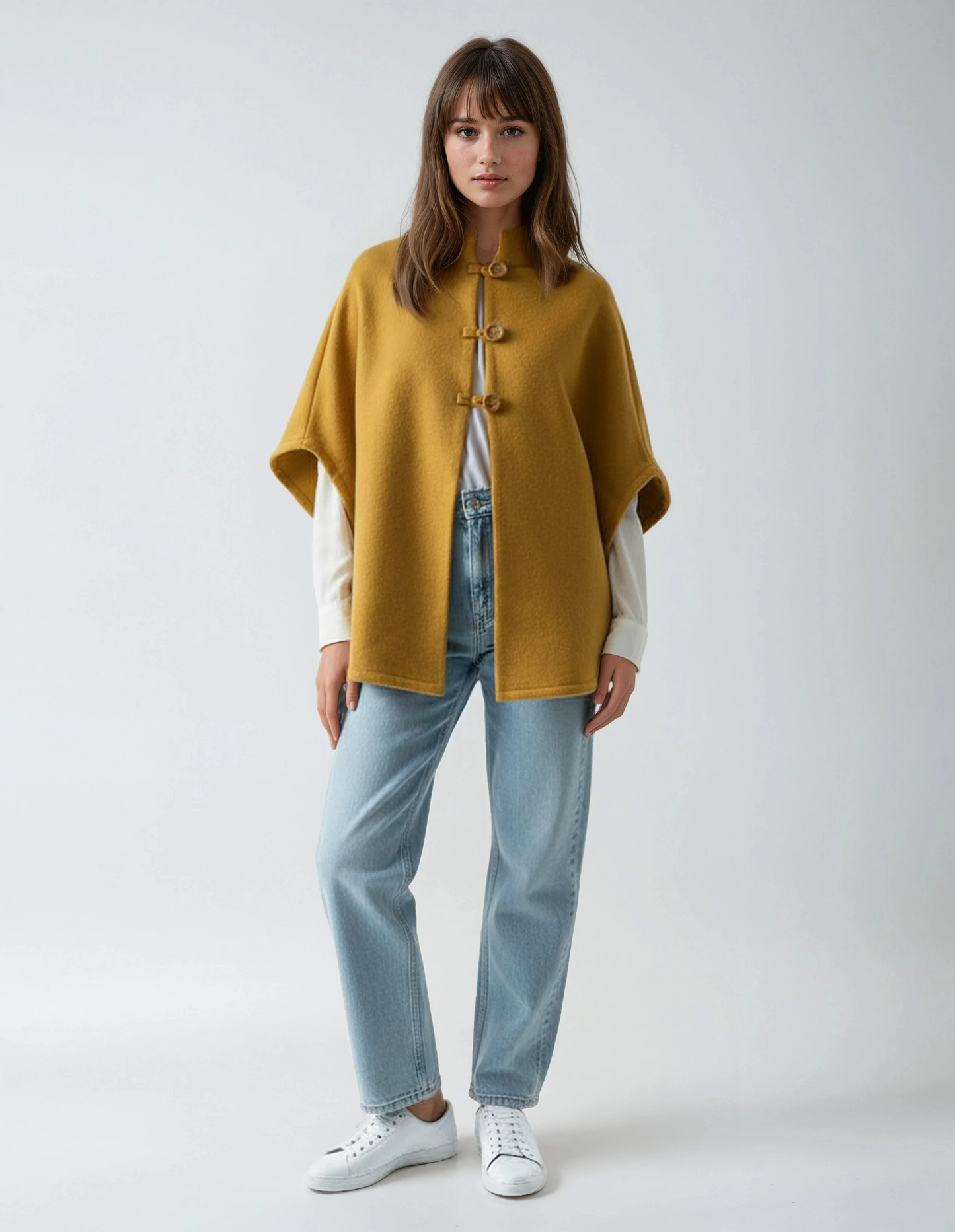 Mustard wool poncho. Sophisticated and timeless lambswool wrap with wooden buttons