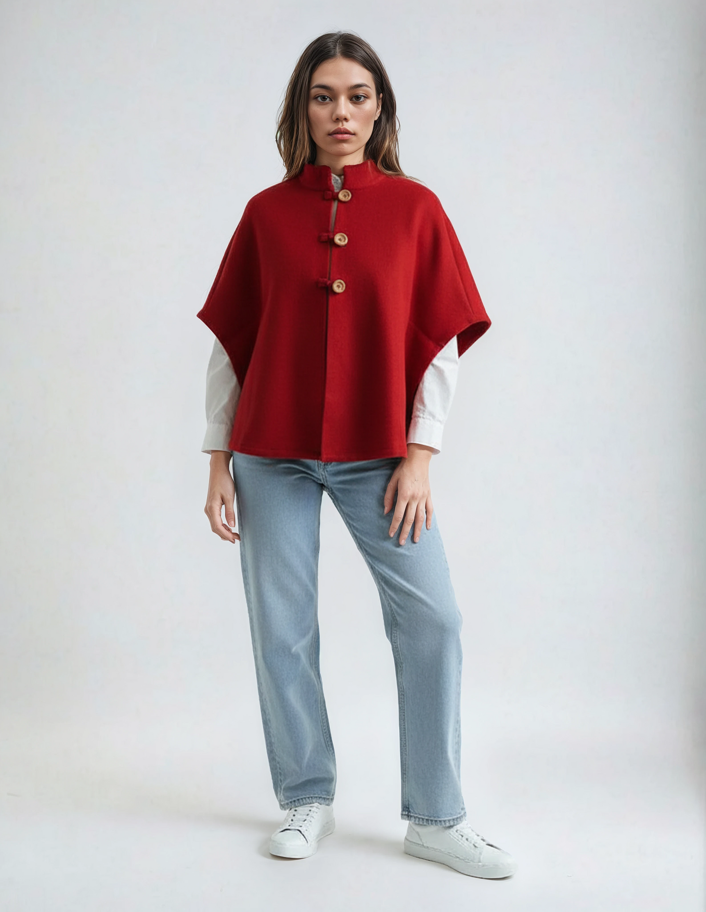 Red wool poncho. High-quality, soft lambswool for women, featuring a wooden button detail