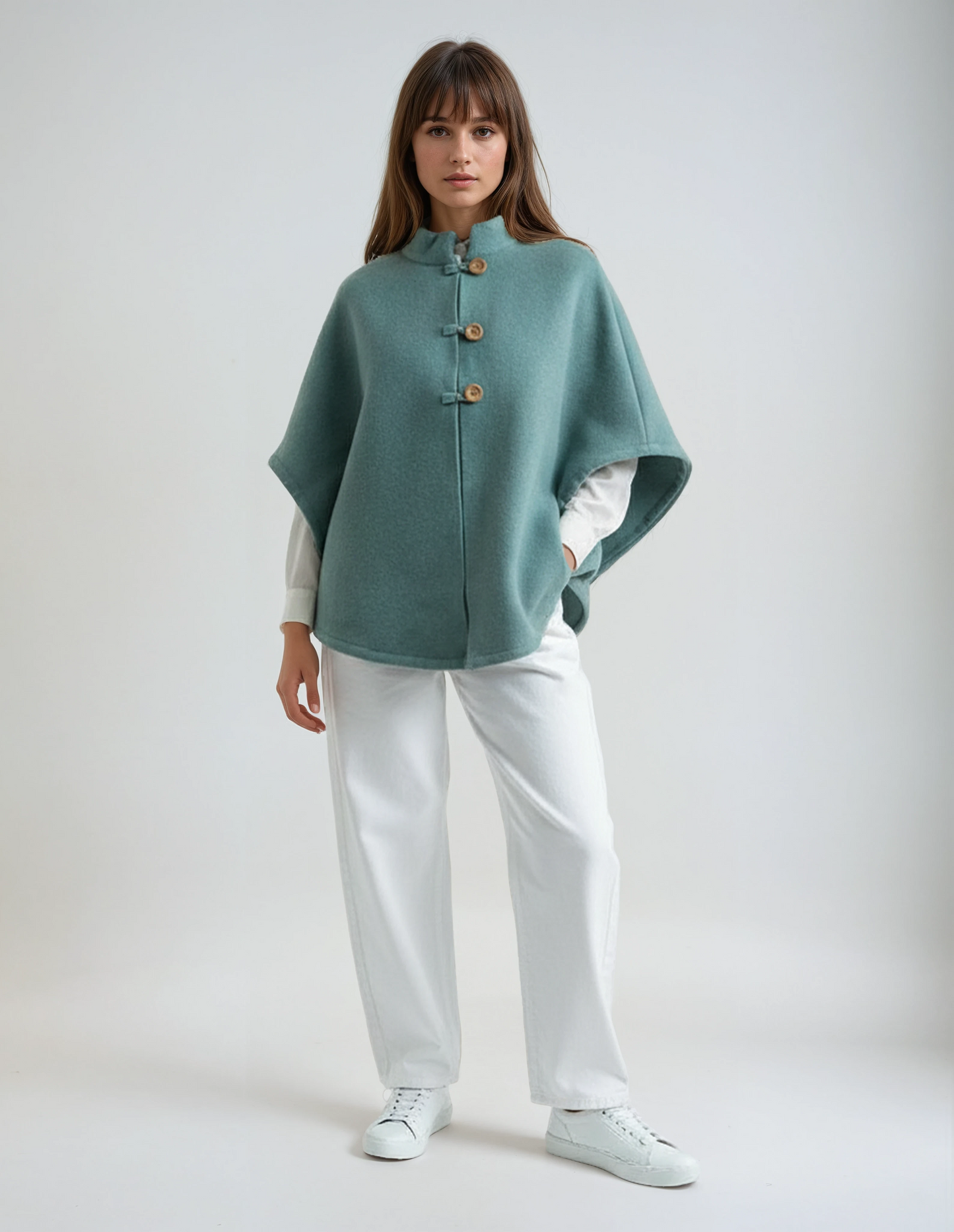 Sapphire wool poncho. Sophisticated and timeless lambswool wrap with wooden buttons