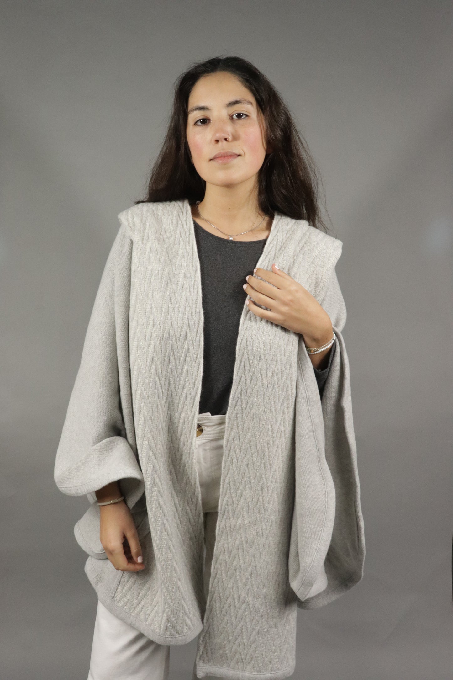 Light grey lambswool cape with classic herringbone pattern. Wool outerwear, sophisticated and made in Portugal