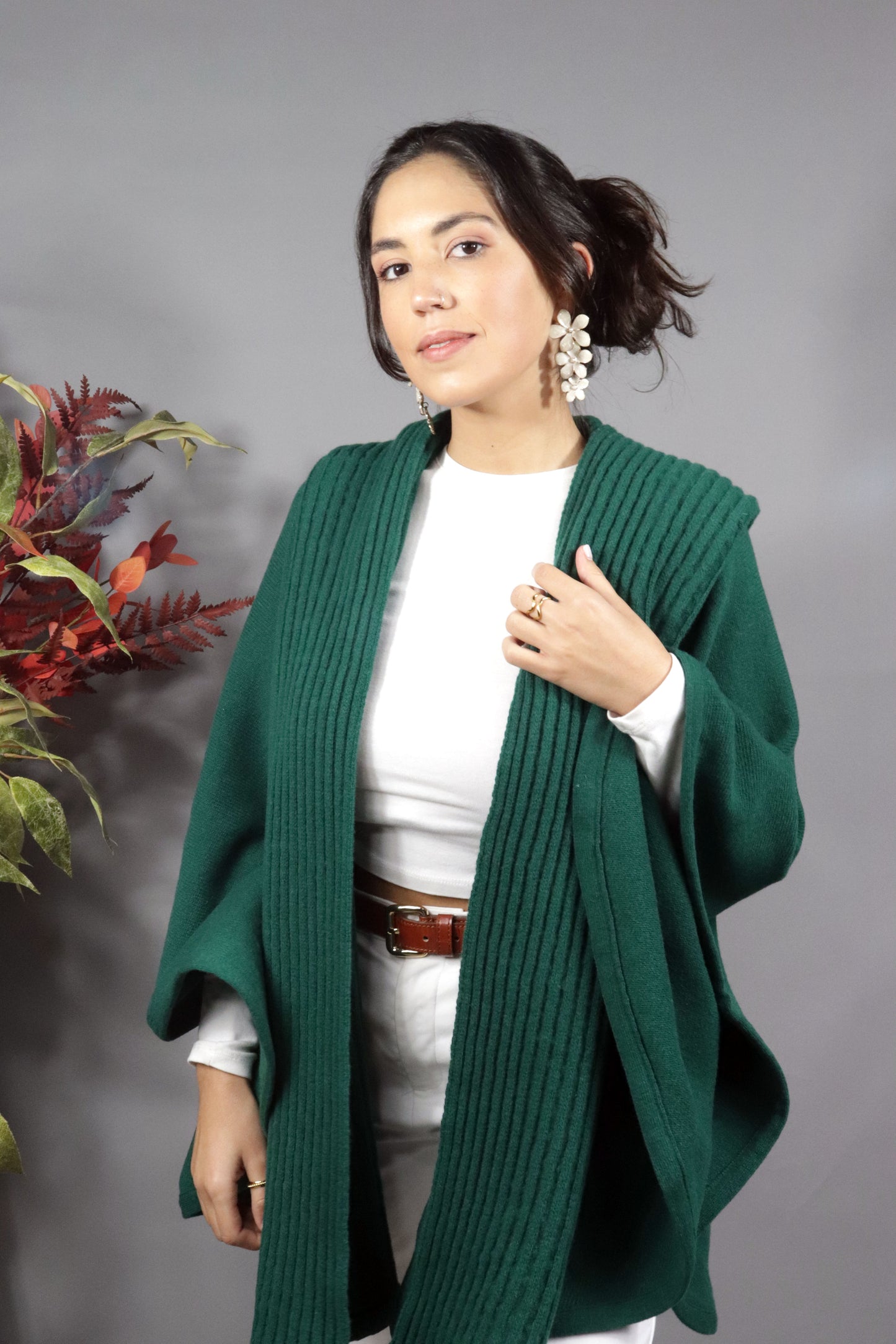 Green wool cape with ribbed pattern. Heavy lambswool knit with hood, high-quality knitwear
