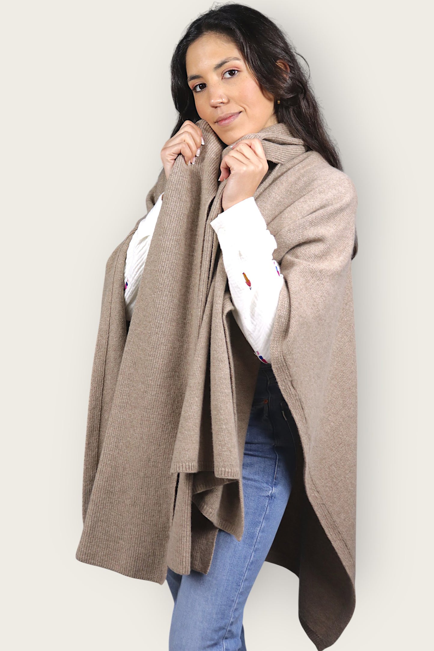 Beige lambswool scarf cape in pearl knit. Elegant wool cape for stylish winter layering