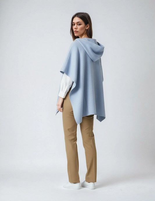 Baby blue one-size wool poncho with hood and loose flowing cut