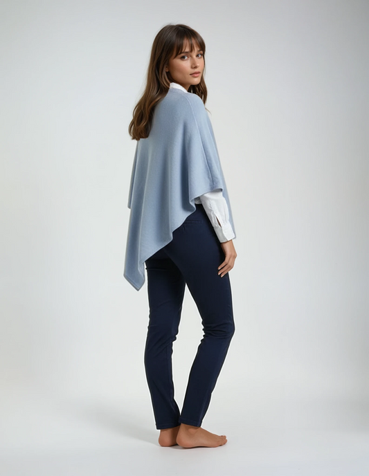 Women's baby blue wool poncho (one size). Versatile and flattering loose fit for easy layering in fall and winter