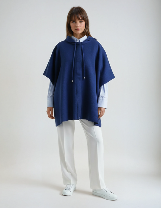 Women's soft wool poncho in dark blue with a hood and front snap closure