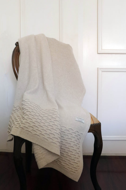 Cozy Sand colored wool blanket—a premium Waves throw for the home