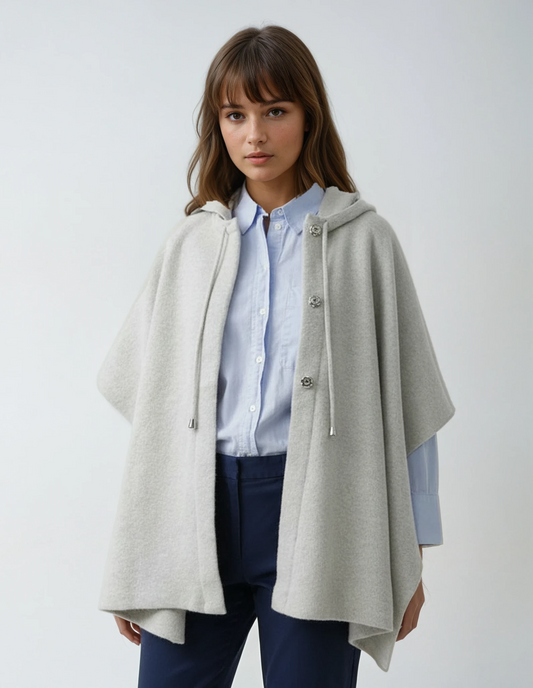 Light gray lambswool hooded poncho. Portuguese knitwear with front closure.