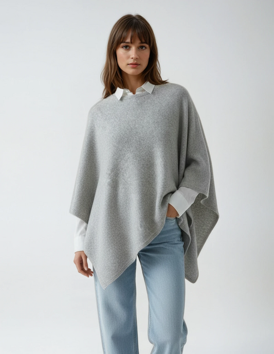 Women's light grey wool poncho (one size). Versatile and flattering loose fit for easy layering in fall and winter