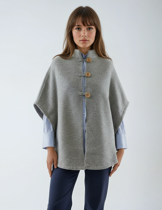 Warm wool poncho in light grey. Premium lambswool knit with wooden buttons, made in Portugal