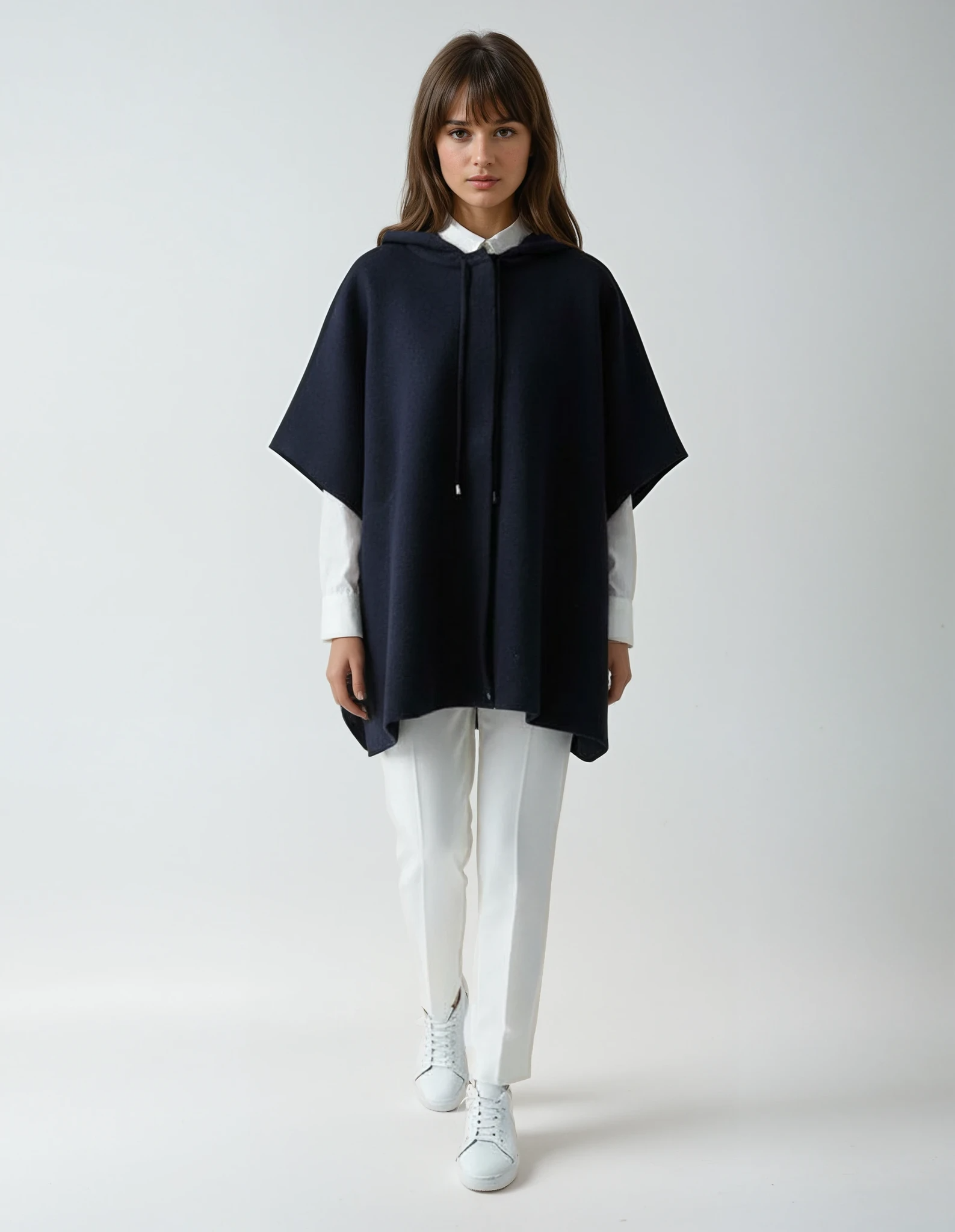Warm one-size knit poncho in navy blue with a hood and drawstring detail