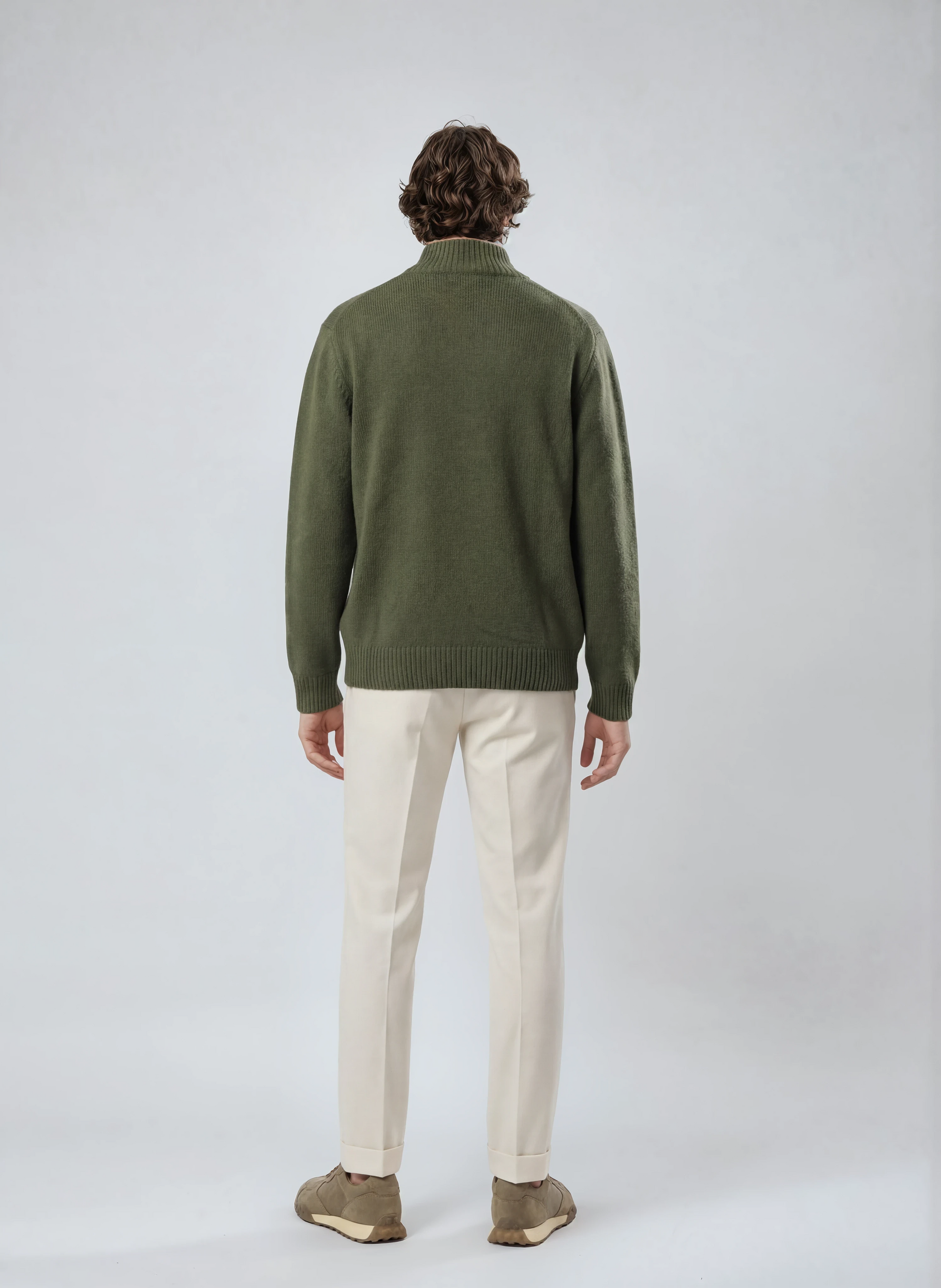 Rear view of a male model wearing a casual full-zip wool cardigan in navy 