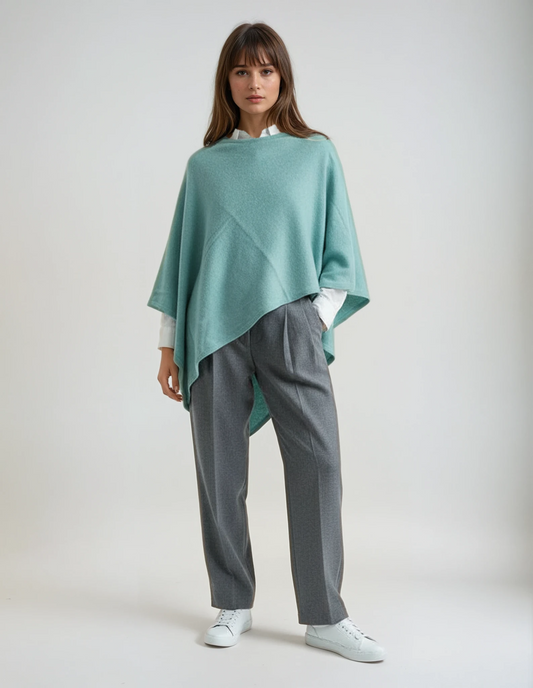 Women's sapphire wool poncho (one size). Versatile and flattering loose fit for easy layering in fall and winter
