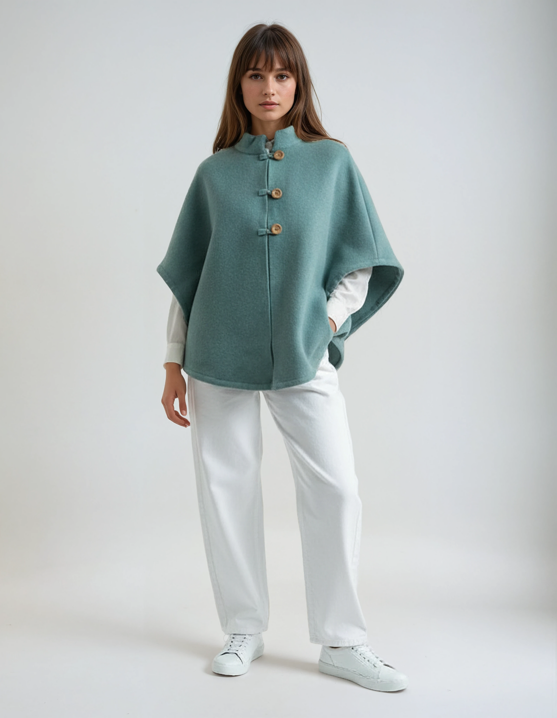 Sapphire wool poncho. Sophisticated and timeless lambswool wrap with wooden buttons